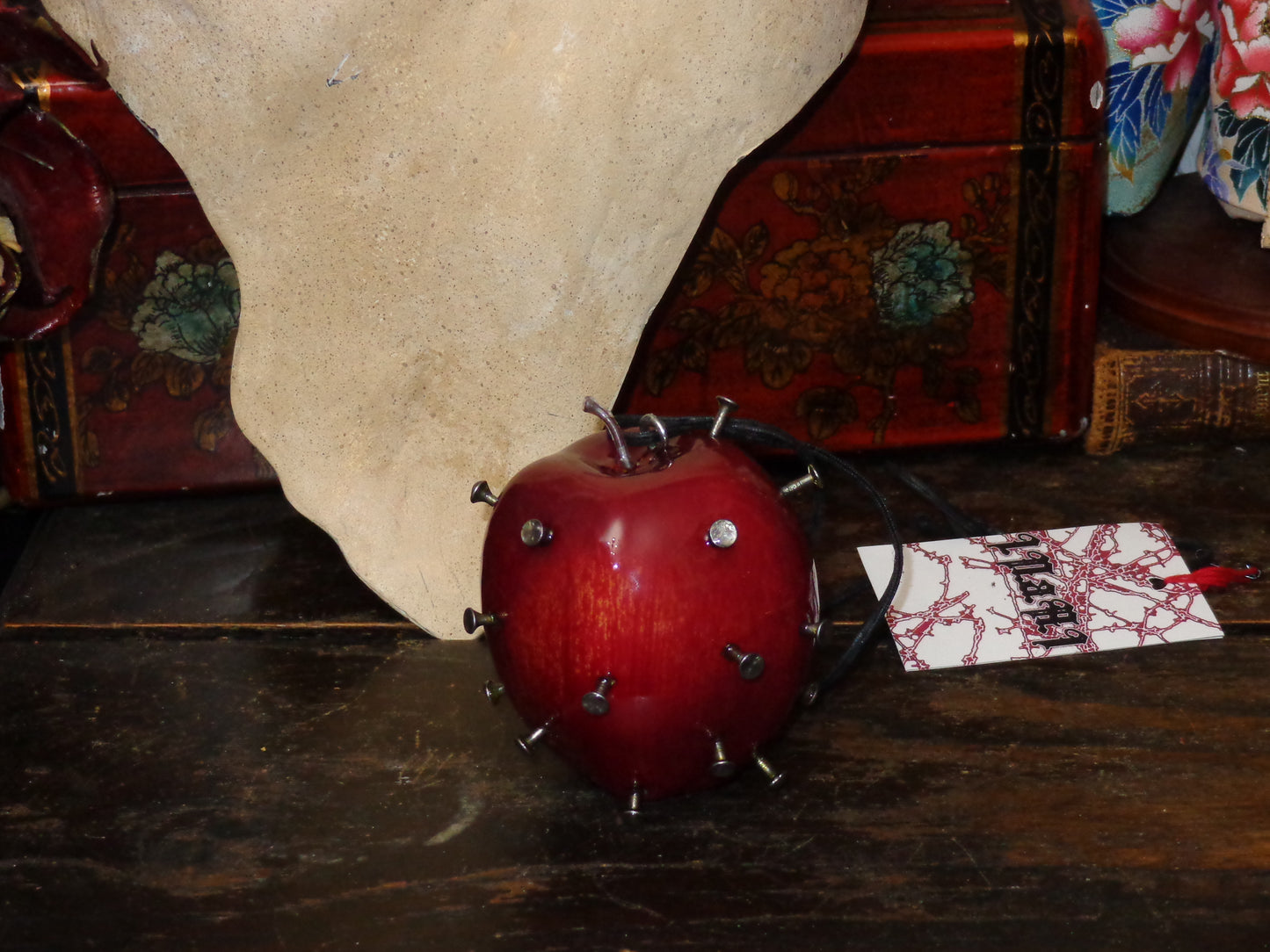 large nailed apple necklace